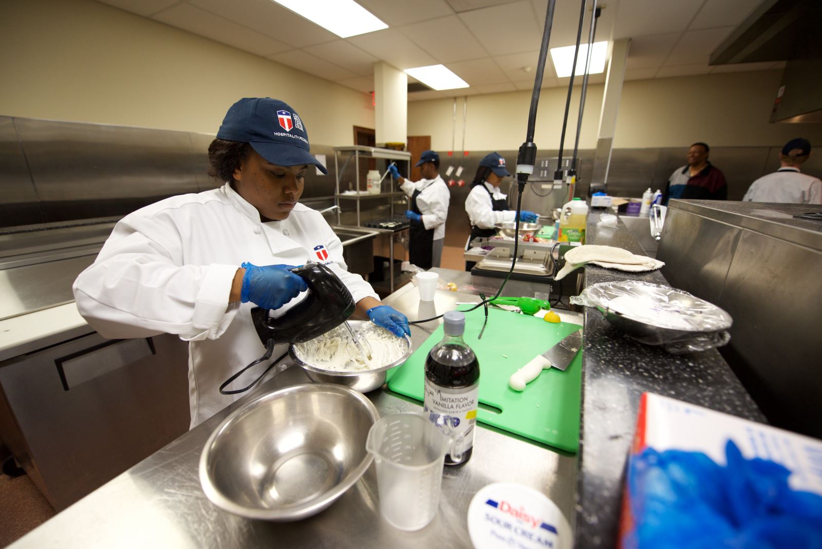 KISD students working in a kitchen as a part of the CTC culinary arts.